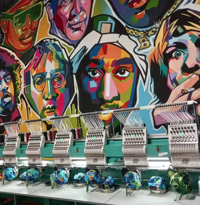 Embroidery heads in front of the Ripprint mural
