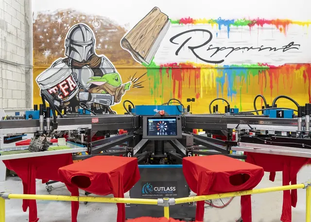 Screen printing press and mural at Ripprint