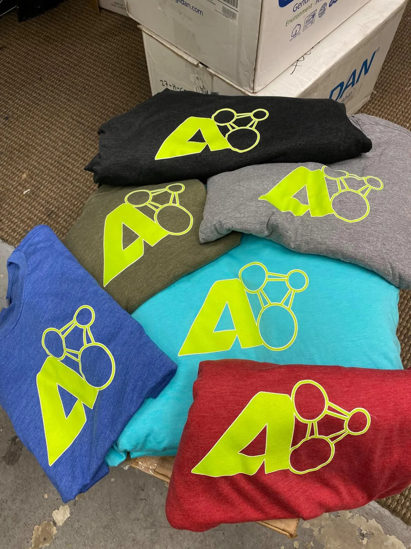 Stack of printed tees at Ripprint