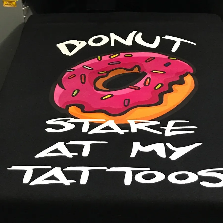 Full color donut print on a black tee
